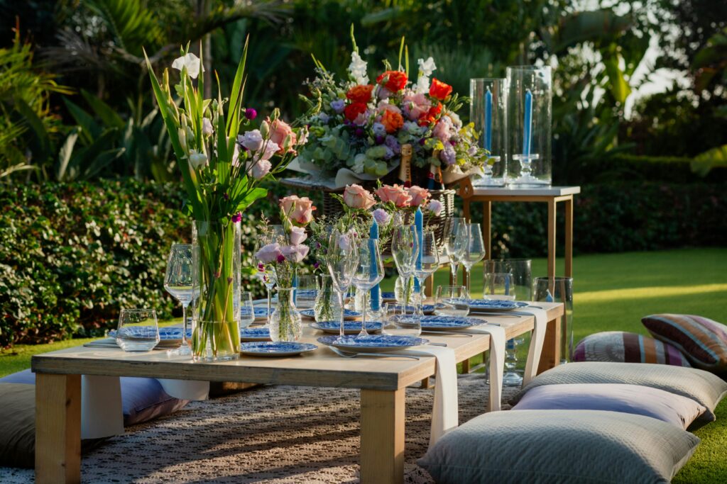 pexels-photo-32640976-32640976 A beautifully decorated outdoor dining table featuring vibrant floral arrangements for a summer garden party.